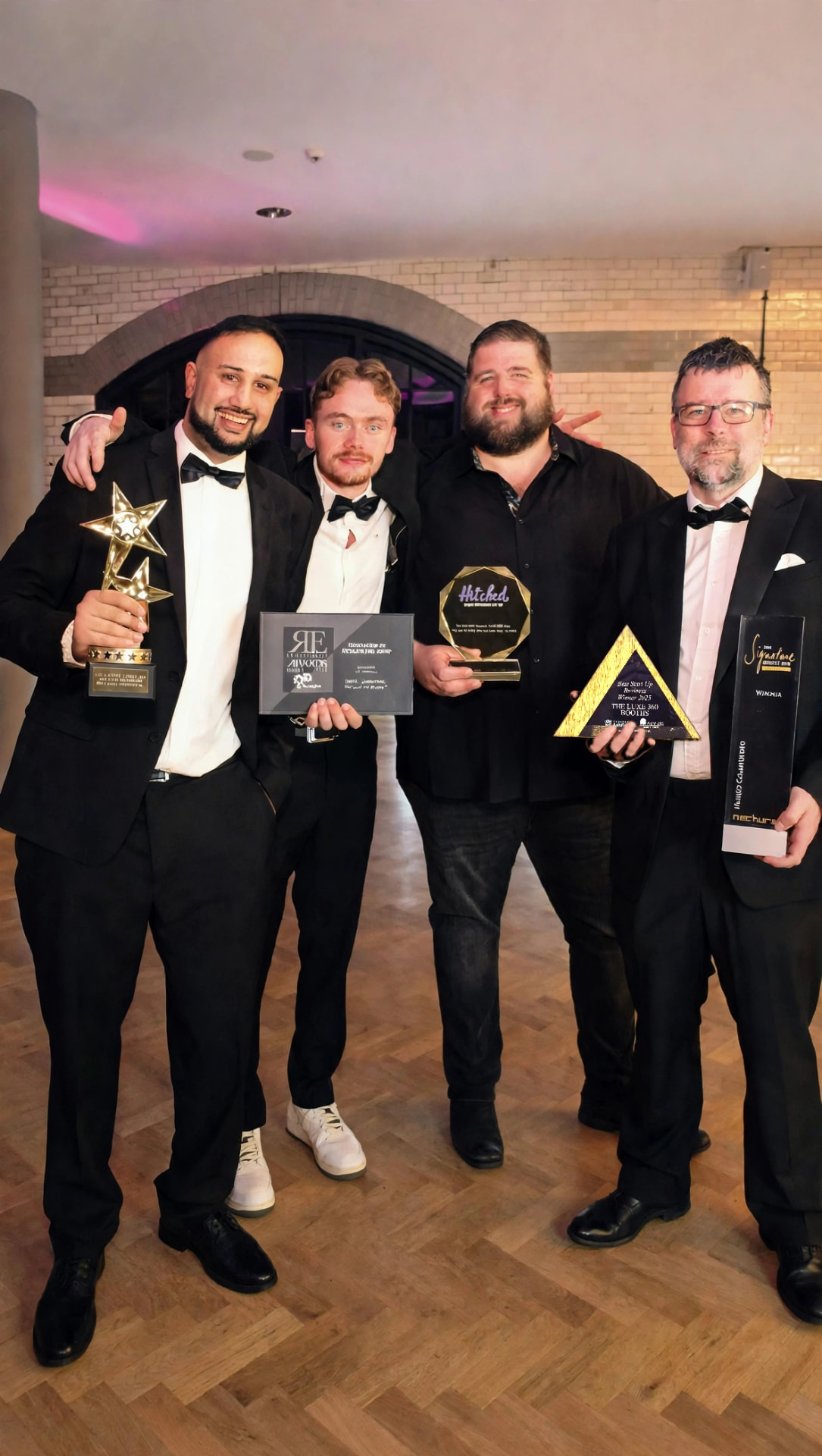 The Luxe 360 Booths team holding their awards
