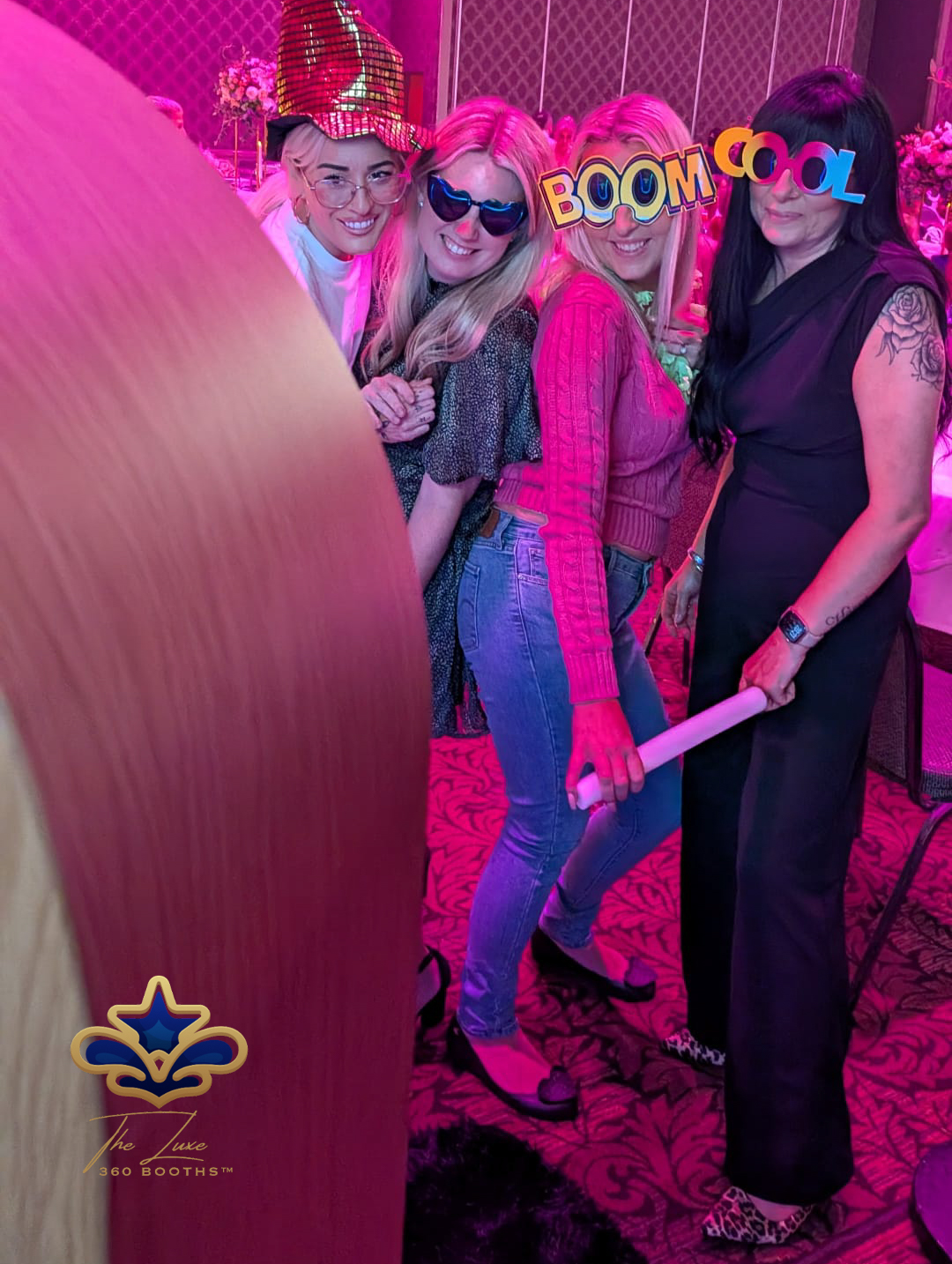 Guests celebrating in a Luxe 360 booth