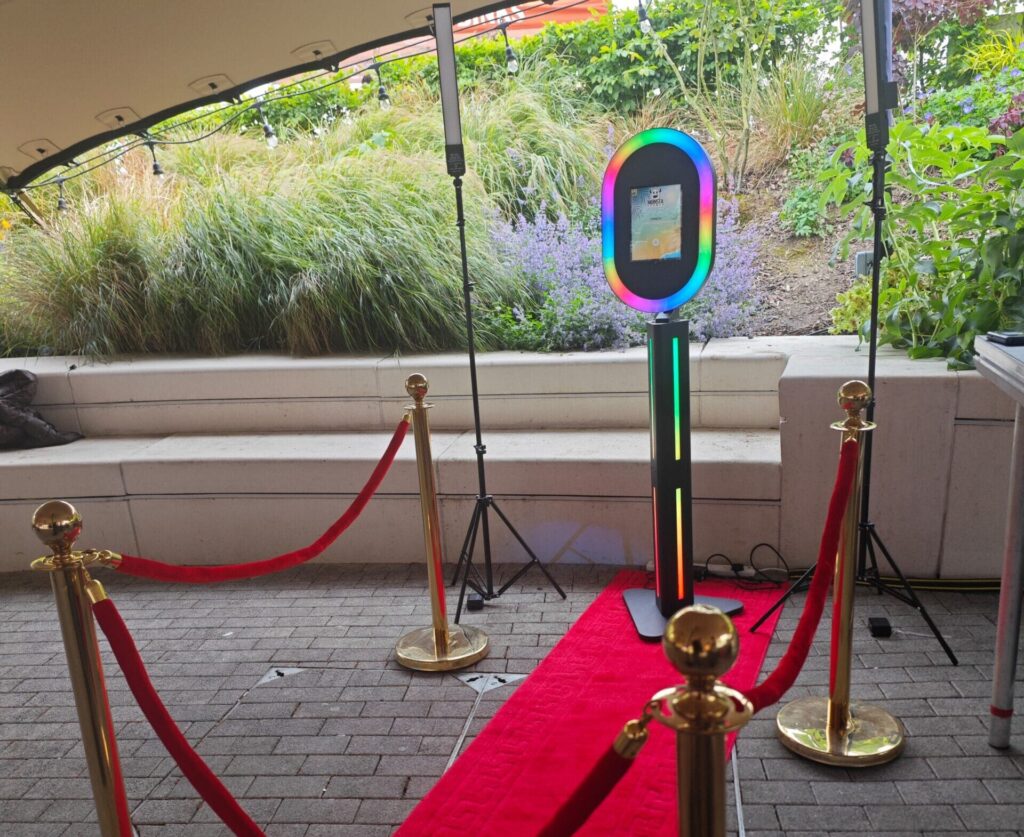Guests packed around the Black Selfie Pod at a luxury wedding