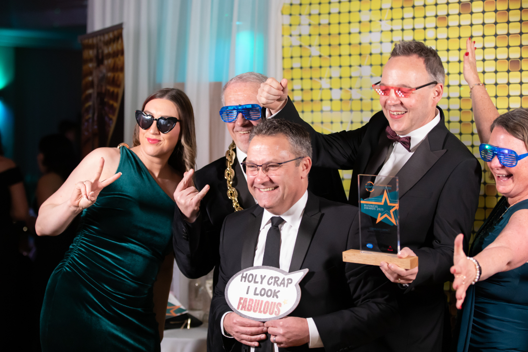 Wedding guests laughing inside a luxury 360 video booth